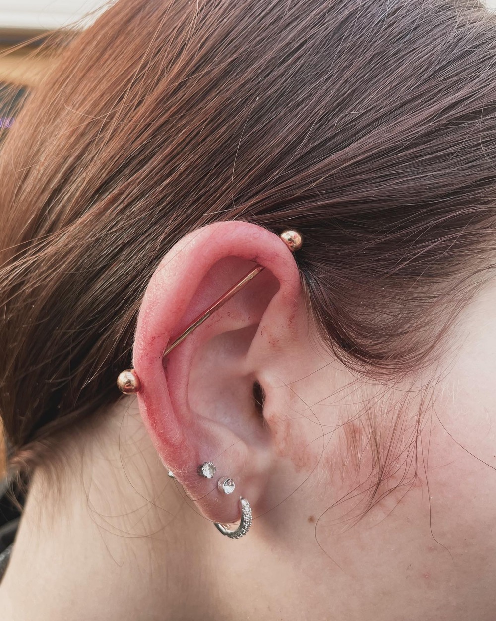 Rose gold scaffold piercing