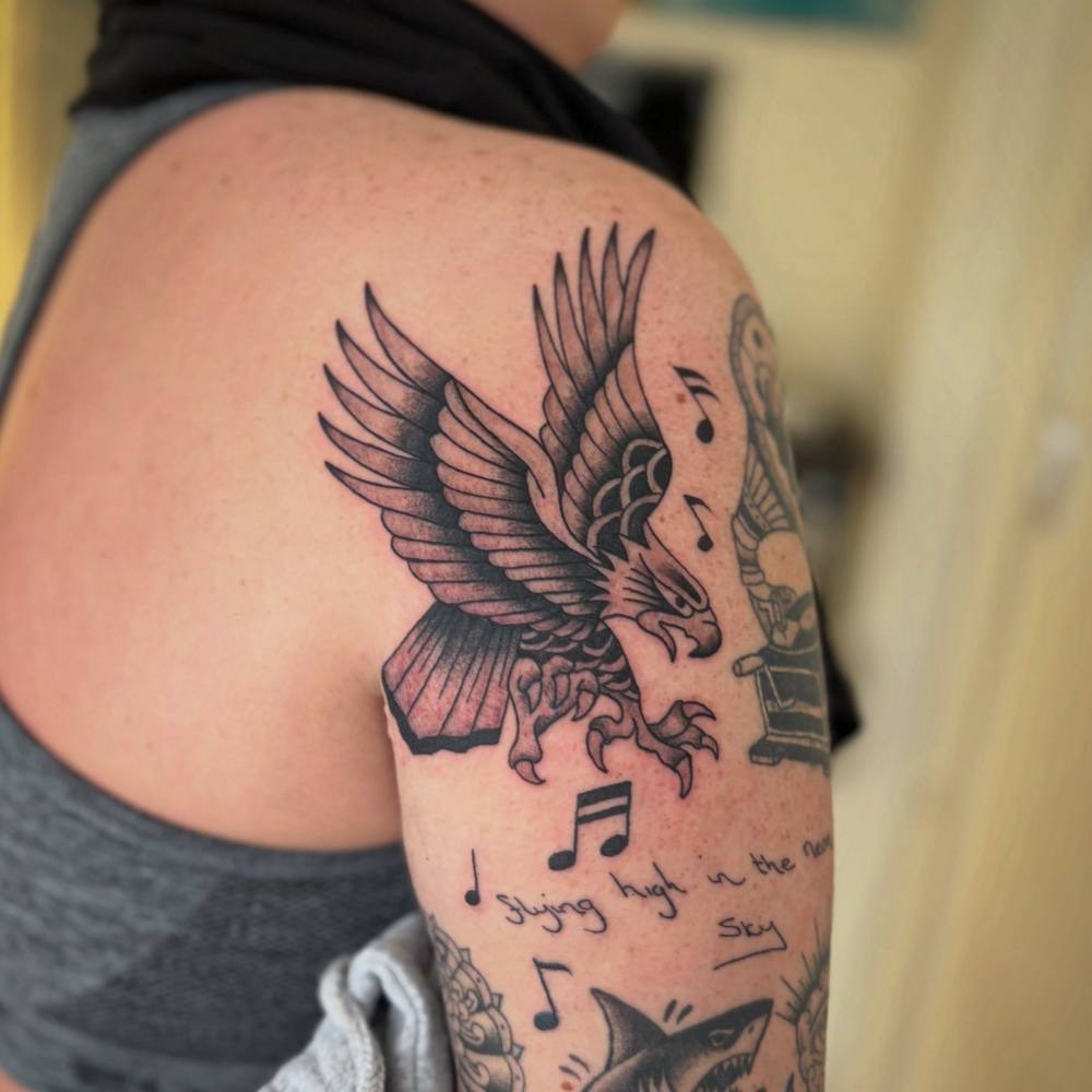 Traditional eagle with music notes