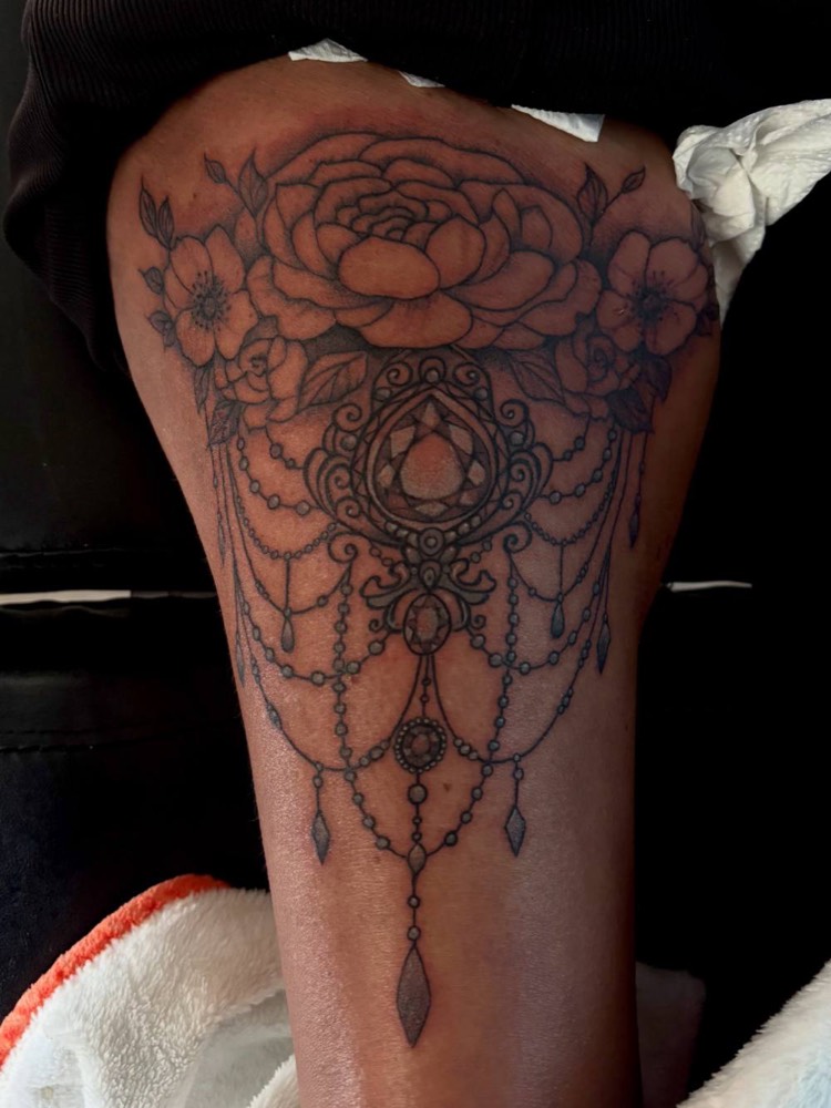 Ornamental floral piece on a thigh
